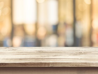 Wooden empty table top on blur background