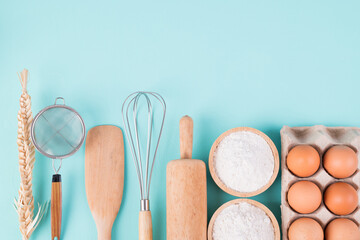 Kitchen utensils and food ingredients for bakery cooking on color background, Top view