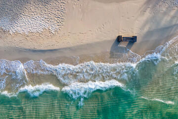 Aerial top view of beautiful sea waves. Summer sea beach in sunny day