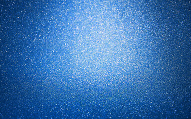 Abstract blue glitter texture background Defocused. Concept for decoration, holiday,...