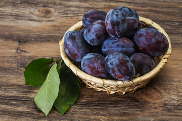Ripe plum heap in the basket