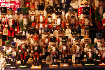 Christmas market stall with colorful Nutcracker wooden soldiers  
