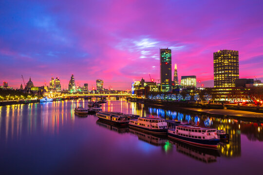 Southbank of river Thames in London at sunrise. England
