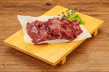 Raw chicken liver over board