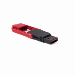 Red and black plastic USB flash drive isolated on white background