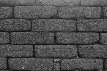 Black and grey bricks old wall. Abstract background. Backdrop wallpaper and Texture concrete grunge for building.
