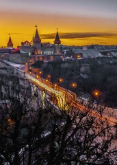 Fototapeta na wymiar Kamianets-Podilskyi fortress on a winter night