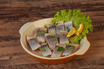 Herring fillet with sliced lemon