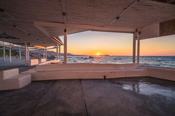 Fototapeta na wymiar Beautiful sunset at Aegean sea seen from Mykonos promenade, Greece