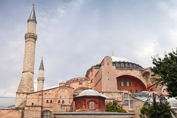 Fototapeta na wymiar Exterior and minarets of Hagia Sophia under cloudy sky