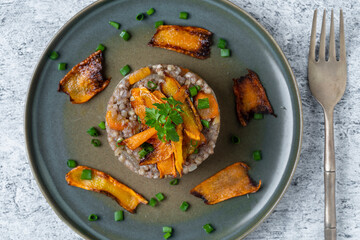 Boiled buckwheat with fried carrots and onions, close up