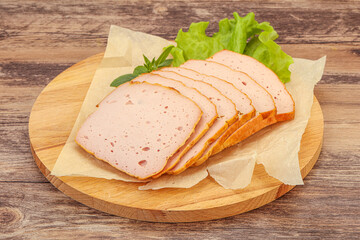 Boiled pork sausage over board