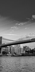 Fototapeta na wymiar NEW YORK CITY - JUNE 10, 2013: The Brooklyn Bridge is a famous city landmark