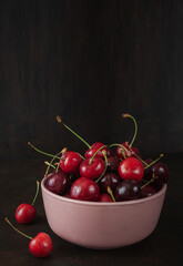 Cherry with leaf on plate and water