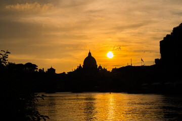 Sunset silhouette of St. Peter's  basilica in Vatican. Italy