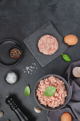 Raw minced meat in bowl on wooden table