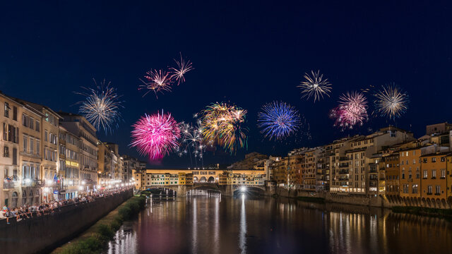 Fireworks display over the Arno River during the Festa di San Giovanni in Florence, Italy