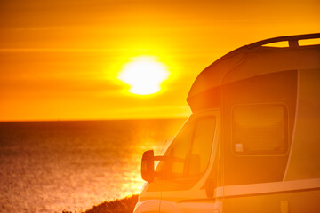 Fototapeta na wymiar Camper car on beach at sunrise