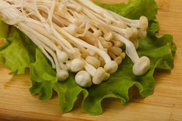 Raw Enoki mushrooms for cooking