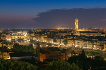Fototapeta na wymiar Night view of Florence city skyline with Arno River and Ponte Vecchio