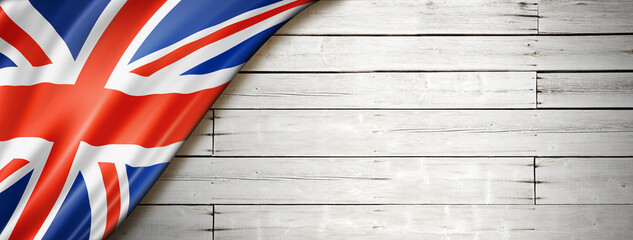 British flag on old white wall banner