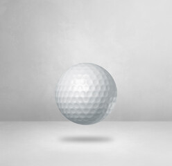White golf ball on a blank studio background