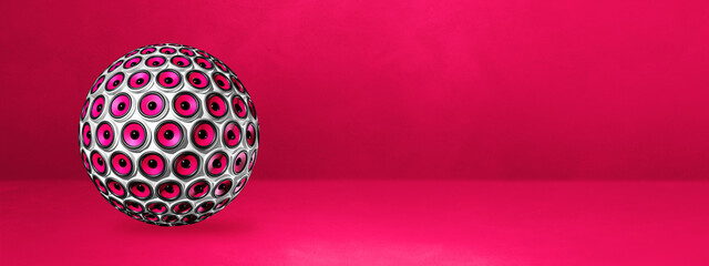 Speakers sphere on a pink studio banner