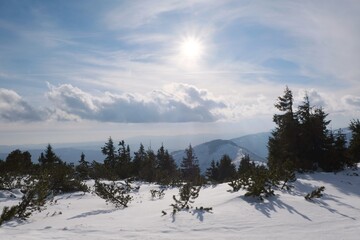 Winter mountain views on red ridge trail from Certovica - Sedlo za Lenivou - Sedlo Homolka during snowshoe tours in Low Tatras in Slovakia