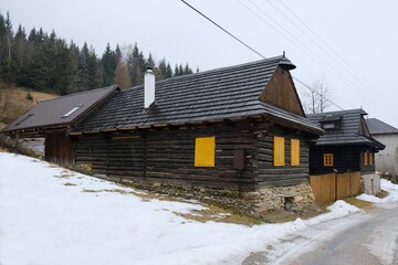 Interesting traditional wooden buildings in Sumiac (Šumiac) village, lying at feet of Kralova hola in Low Tatras in Slovakia © Iwona