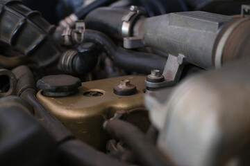 Photo of the engine of the car parked at the auto repair center