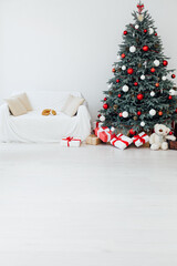 The interior of the white room Christmas tree New Year holiday gifts decor