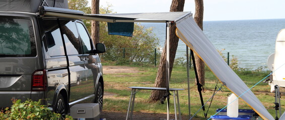 a new mobile home with awning and table and chairs