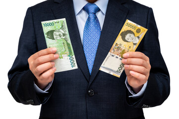 Businessman holding Korean currency in hand on white background.