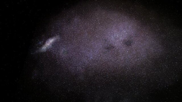 Exploration of galaxies through outer space towards a bright milky-way galaxy. 4K looping animation of flying through bright nebulae, clouds, and star fields. 