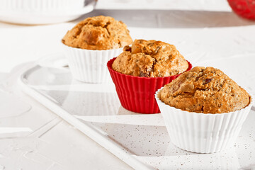 Homemade muffins with ginger and nuts on white table. Healthy eating, gluten free.Homemade tasty dessert or breakfast for Valentine's day,Mother's day