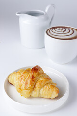 croissant and cup of coffee