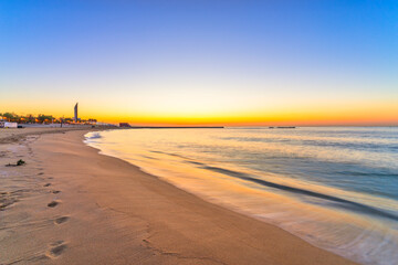 Obraz premium Barceloneta beach at sunrise in Barcelona. Spain
