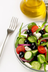 Olives and olive oil and vegetable salad in studio