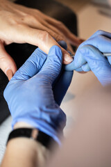 Fototapeta premium Closeup shot of a woman in a nail salon receiving a manicure