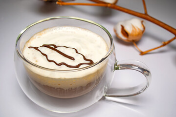 oak leaf printed on a 3d printer with chocolate on a latte cup