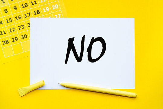 NO. Abstract calendar yellow collour on a yellow background , Business concept written on notepad. Business and financial conzept.