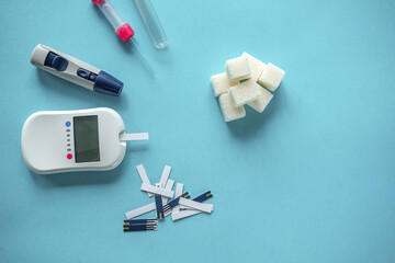 medicine, diabetes diagnostics, healthcare. concept. top view of a blood glucose meter and test...