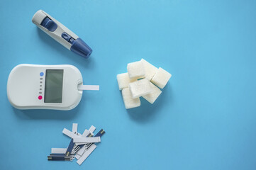 medicine, diabetes diagnostics, healthcare. concept. top view of a blood glucose meter and test...