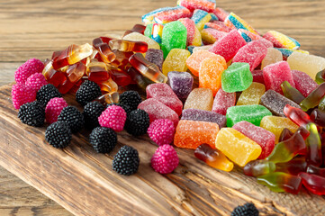 Fruit marmalade sweets, jelly candies on a wooden desk. Fruit natural dessert with sugar