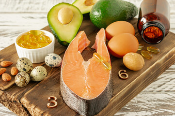 Fototapeta na wymiar Healthy eating concept. Natural sources of omega 3 acids. Vegetables, seafood, nut and seeds