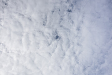Fototapeta na wymiar White clouds cover all over the sky, thick cloud barely see the sky with copy space for text