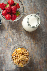 Strawberries and blueberries for dessert close up, top view