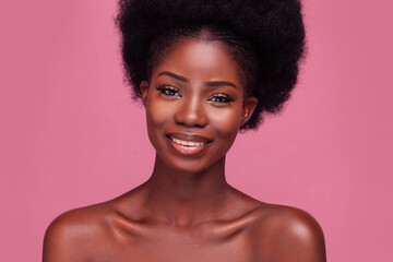 Portrait of a gorgeous fashion model African American girl smiling on camera with bare shoulders...