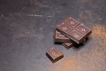 Stack of chocolate on black background