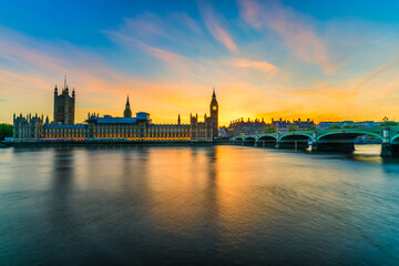 Naklejka na ściany i meble Scenic view of Big Ben and British parliament at sunset in London. England